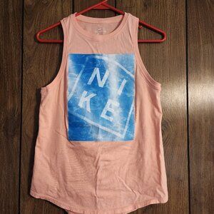 This Women's Nike Sleeveless Tank Tee in size small features a solid peach color